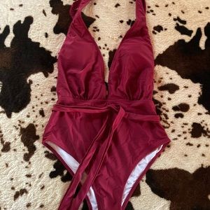 One-piece halter style suit. Size Medium.